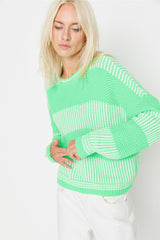 green knitted top