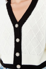 white buttoned cardigan
