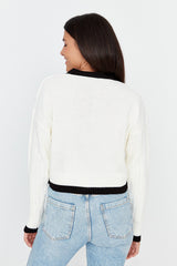 white buttoned cardigan