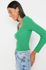 green knit top