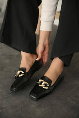 Black leather flats