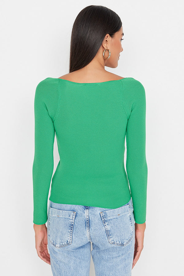 green knit top