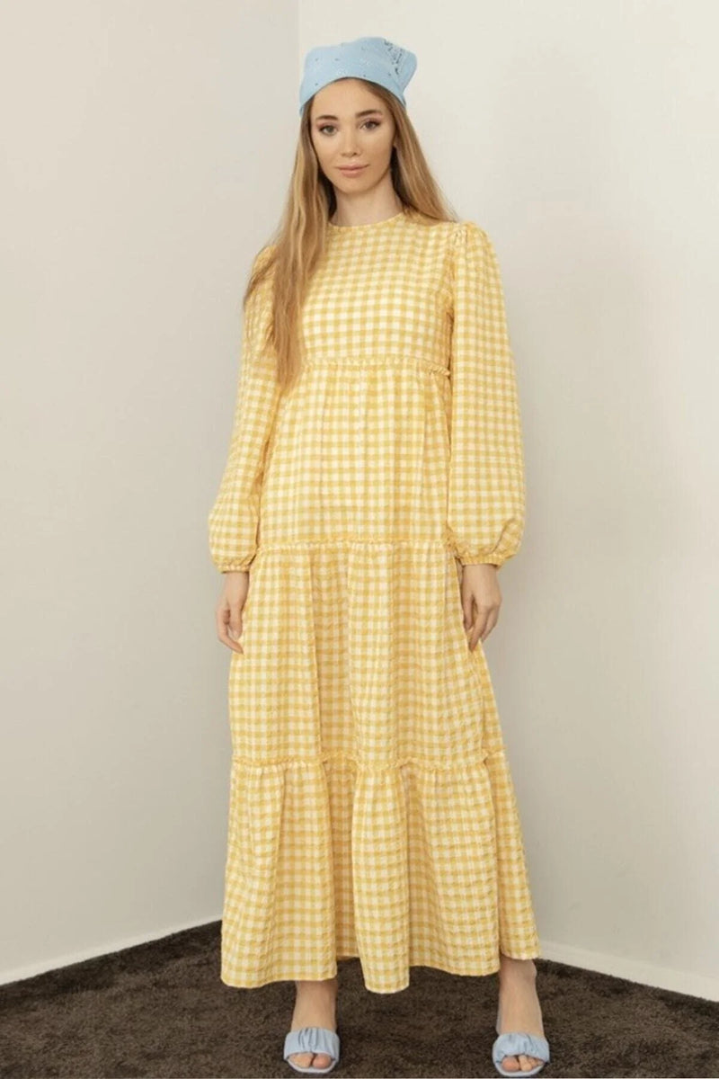 modest yellow dress INTRODUCING THE NOORA IN BUTTER PERFECT FOR THE SUMMER AVAILABLE IN FREE SIZE COMMENT FOR MORE INFO DM FOR ORDERS #fashion #fashionable #summer2024 #hijab #hijabfashion #modest # Lightweight woven floral print Gathered bodice Scoop neckline with a front drawstring with elastic shoulders and back Large balloon sleeves Empire waist Back elastic waist Multiple gathered tiers Fully lined Fabric content Yellow Modest dress Ayesha v-neck