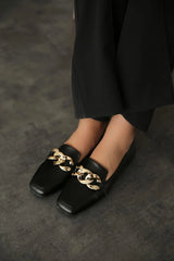 Black leather flats